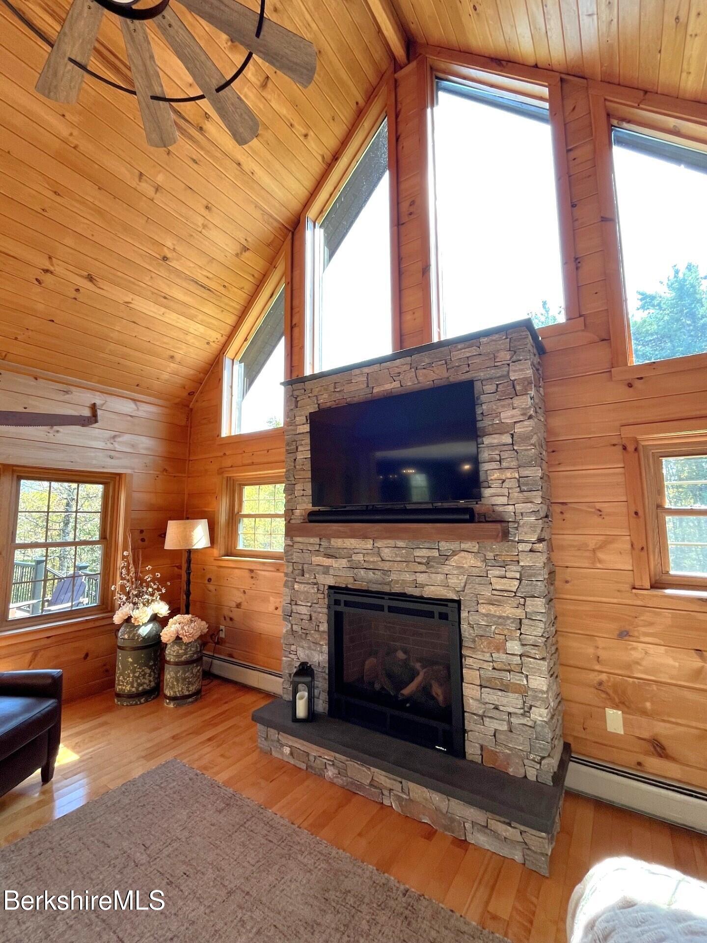 1020 Cascade Street Pittsfield, MA 01201 - Photo 26 of 75 a living room with furniture large window and a fireplace
