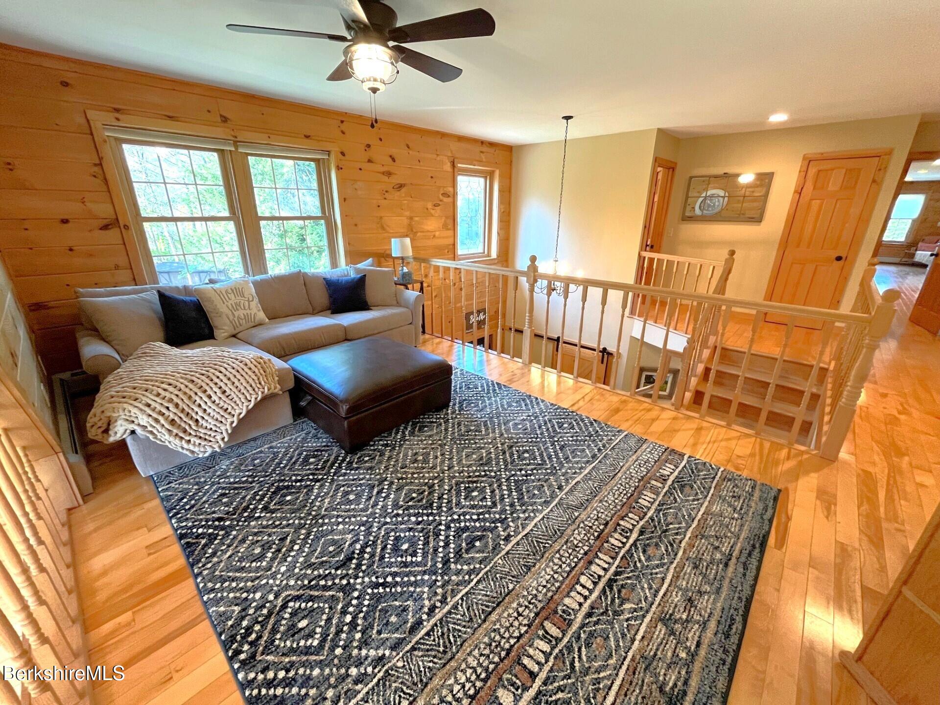 1020 Cascade Street Pittsfield, MA 01201 - Photo 30 of 75 a living room with furniture and a rug