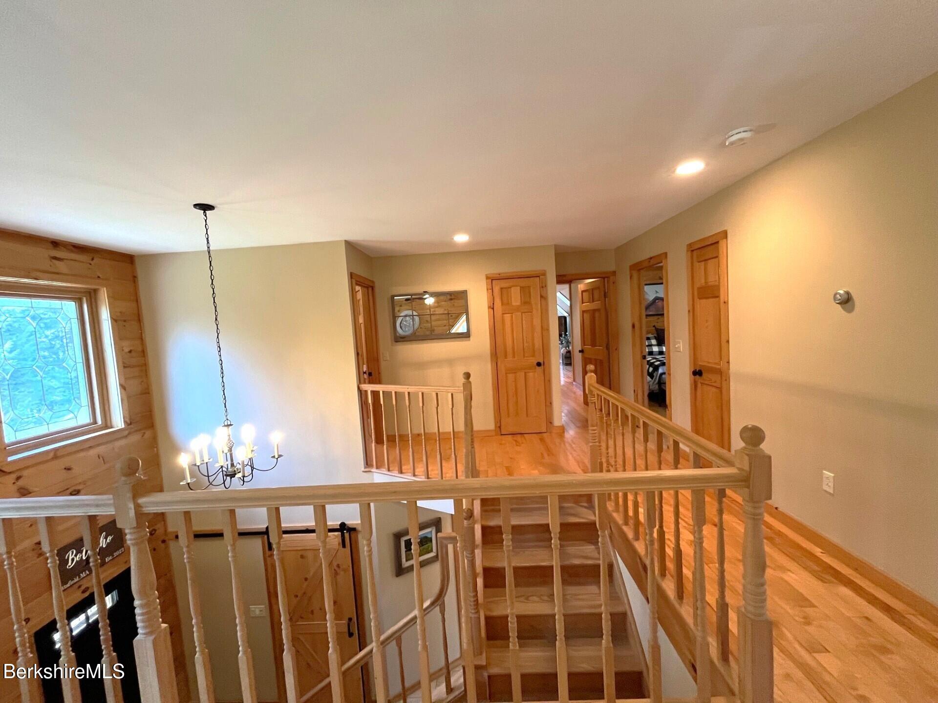 1020 Cascade Street Pittsfield, MA 01201 - Photo 33 of 75 a view of a hallway with wooden floor and windows