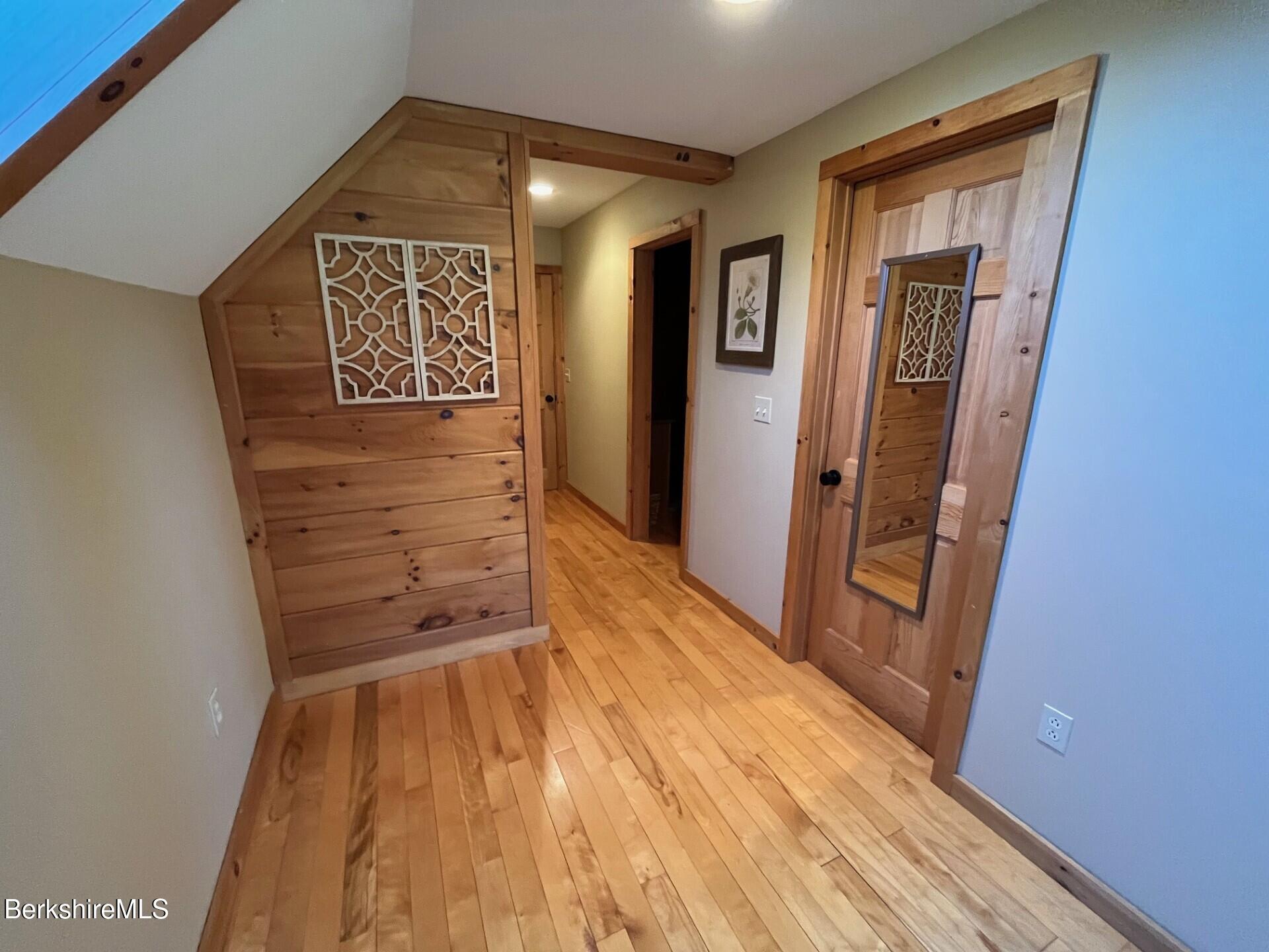 1020 Cascade Street Pittsfield, MA 01201 - Photo 36 of 75 a view of a hallway with wooden floor and a hallway