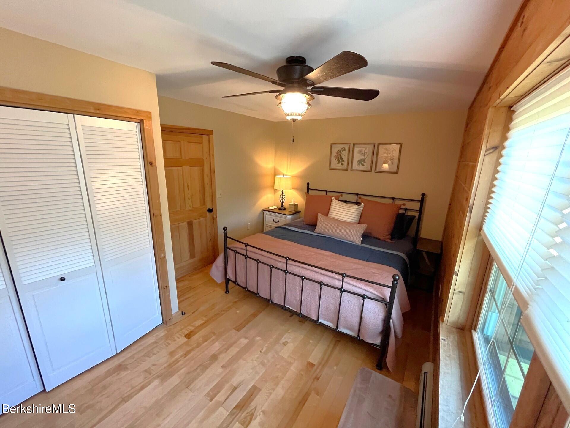 1020 Cascade Street Pittsfield, MA 01201 - Photo 39 of 75 a bedroom with a bed and a large window