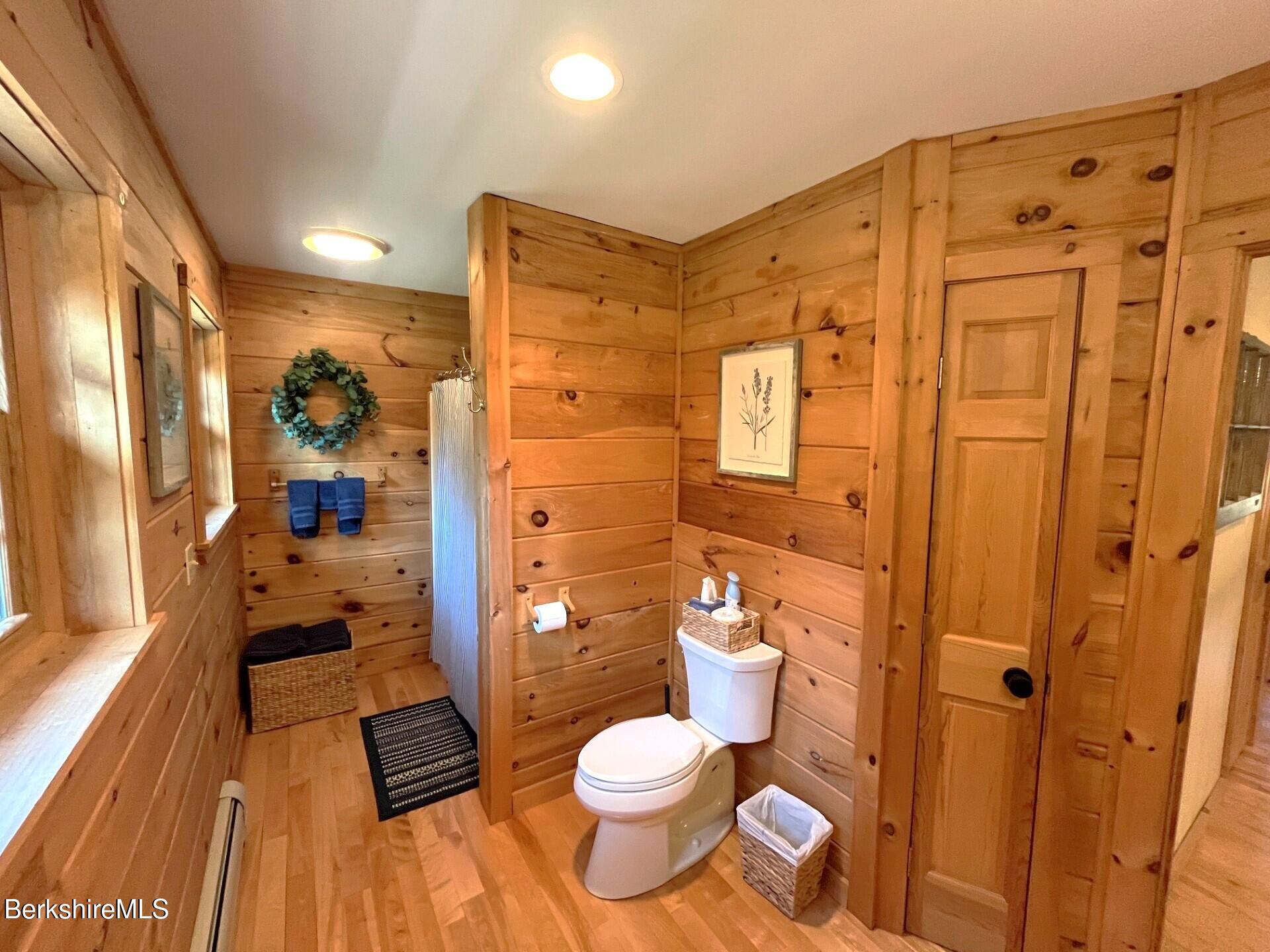1020 Cascade Street Pittsfield, MA 01201 - Photo 42 of 75 a bathroom with a granite countertop toilet sink and shower