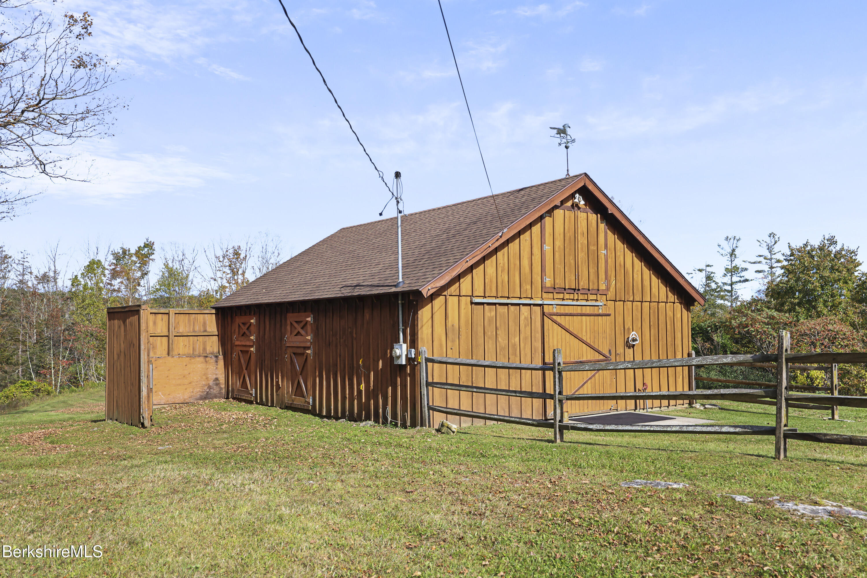 1020 Cascade Street Pittsfield, MA 01201 - Photo 58 of 75 a view of backyard with small garden and wooden fence