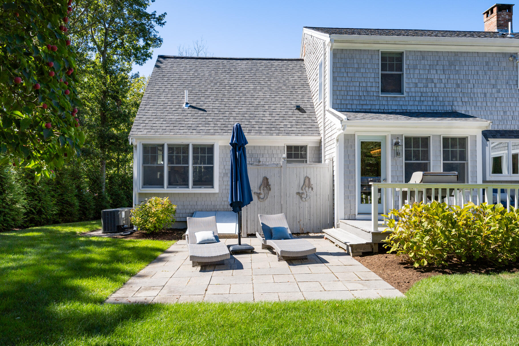12 Paddocks Path East Dennis, MA 02638 - Photo 57 of 64 a view of a house with backyard sitting area and garden
