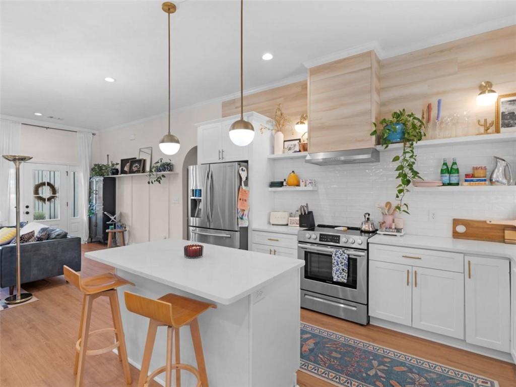 701 Marks Road Mansfield, GA 30055 - Photo 11 of 50 a kitchen with a sink a stove and chairs