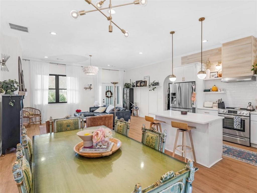 701 Marks Road Mansfield, GA 30055 - Photo 15 of 50 a living room with kitchen island furniture and a chandelier