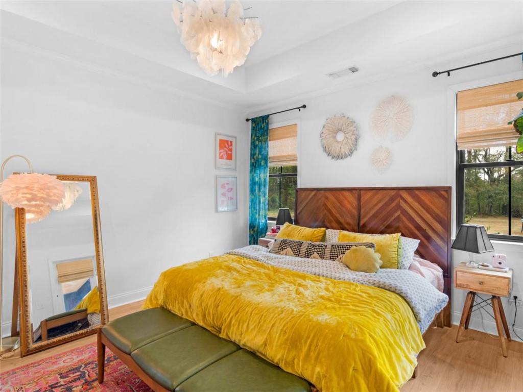 701 Marks Road Mansfield, GA 30055 - Photo 17 of 50 a bedroom with a bed and dresser with mirror