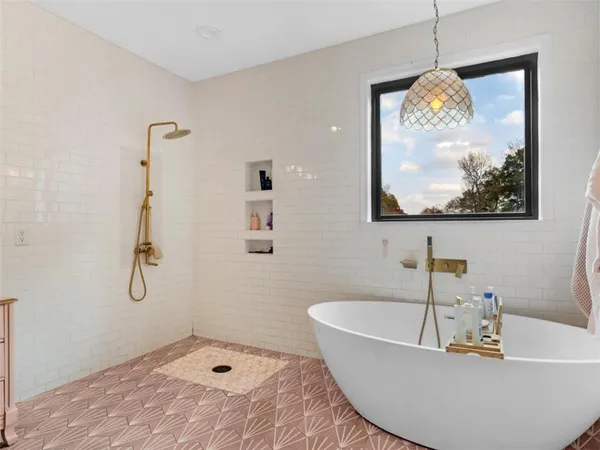 a bathroom with a sink mirror and vanity
