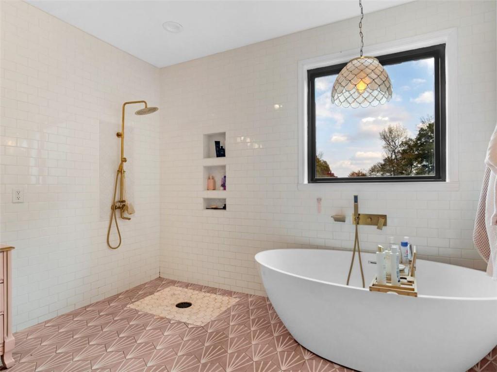 701 Marks Road Mansfield, GA 30055 - Photo 20 of 50 a bath tub sitting next to a bathroom sink