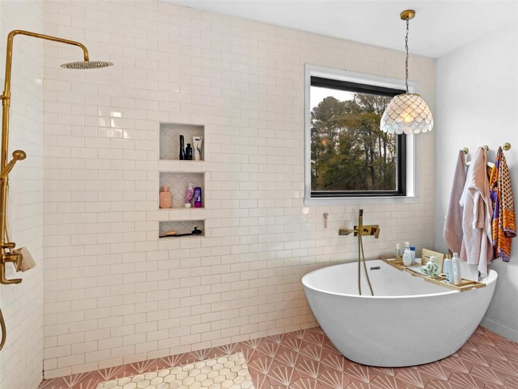 701 Marks Road Mansfield, GA 30055 - Photo 22 of 50 a bathroom with a tub sink and mirror