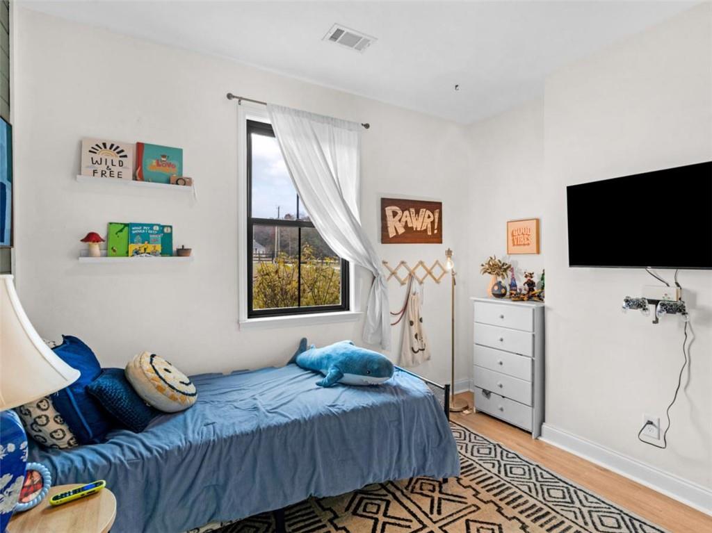 701 Marks Road Mansfield, GA 30055 - Photo 30 of 50 a bedroom with a bed and flat screen tv