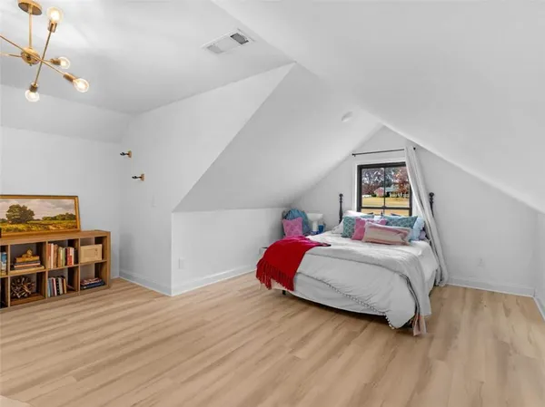 a bed room with a bed and a television