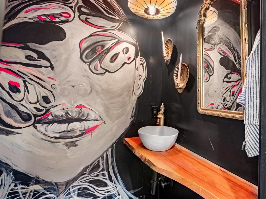 701 Marks Road Mansfield, GA 30055 - Photo 40 of 50 a bathroom with a sink and mirror with painted walls