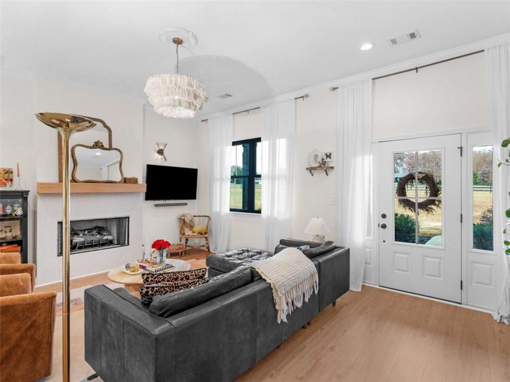 701 Marks Road Mansfield, GA 30055 - Photo 4 of 50 a spacious bedroom with a bed and a flat screen tv