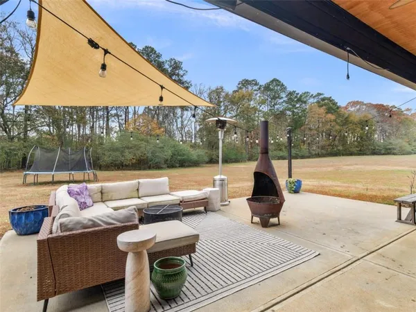 a view of swimming pool with a patio