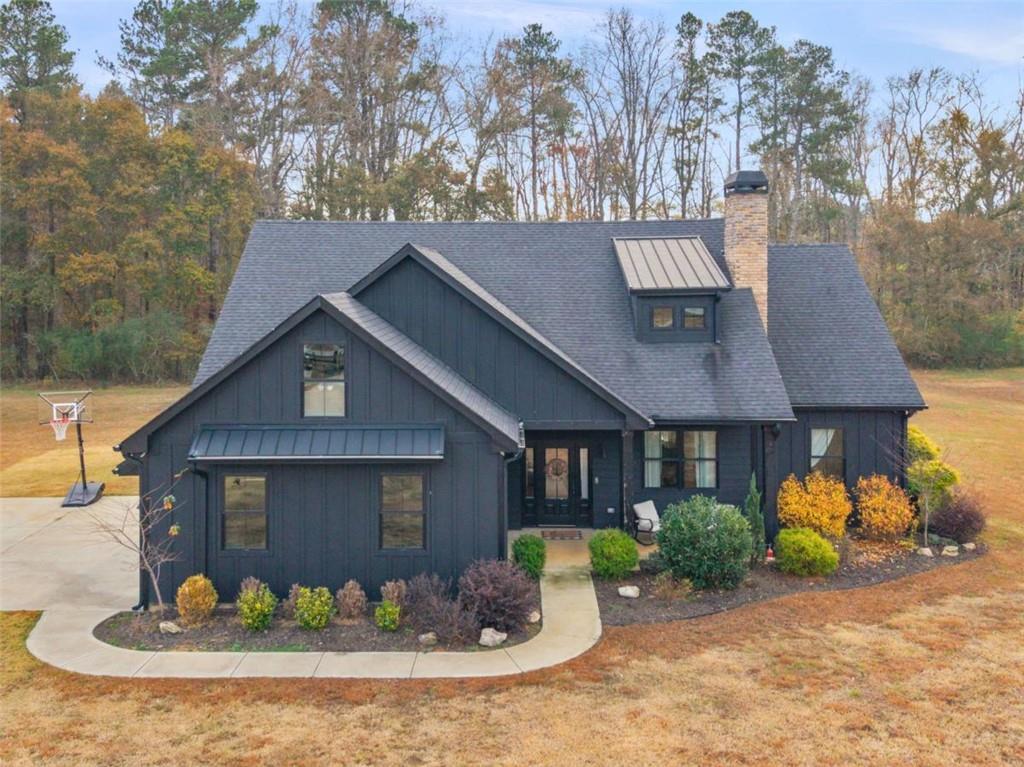 701 Marks Road Mansfield, GA 30055 - Photo 48 of 50 a front view of a house with a yard and potted plants