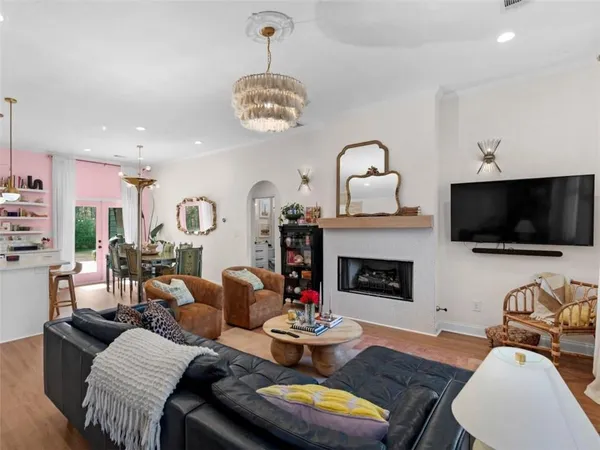 a living room with furniture fireplace and flat screen tv