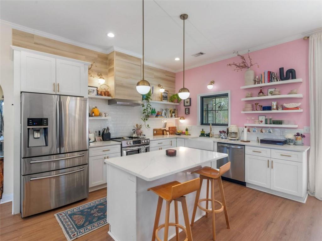 701 Marks Road Mansfield, GA 30055 - Photo 8 of 50 a kitchen with stainless steel appliances a stove a sink a refrigerator a center island and appliances