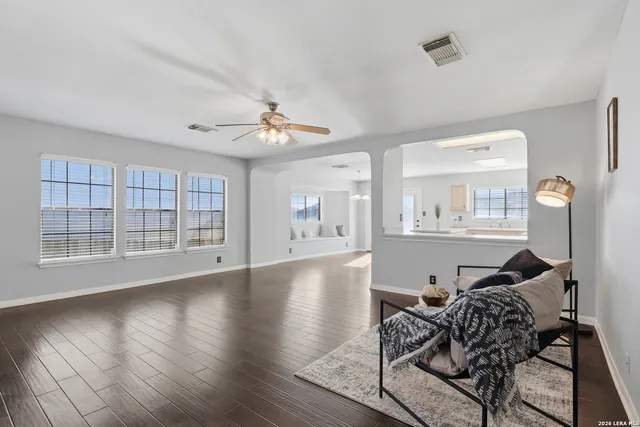 a workspace with wooden floor and a window