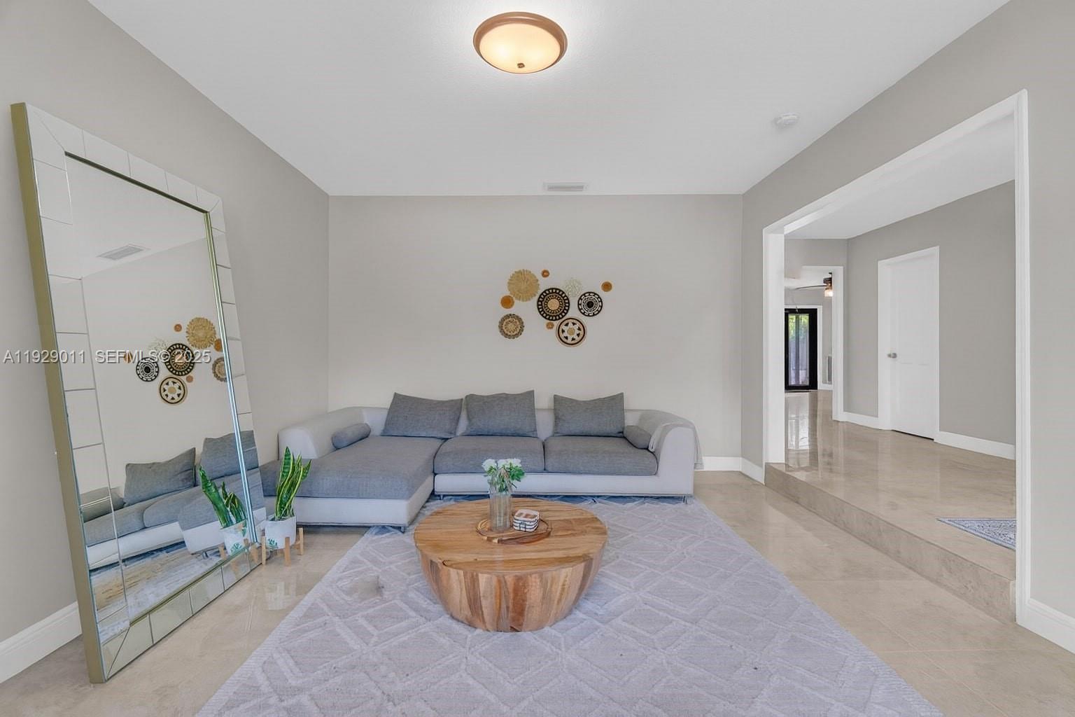16900 Southwest 276th Street Homestead, FL 33031 - Photo 13 of 22 a living room with furniture and a couch