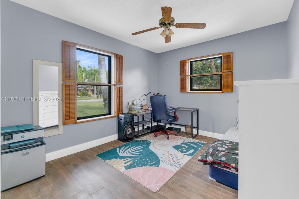 16900 Southwest 276th Street Homestead, FL 33031 - Photo 14 of 22 a living room with furniture and a window