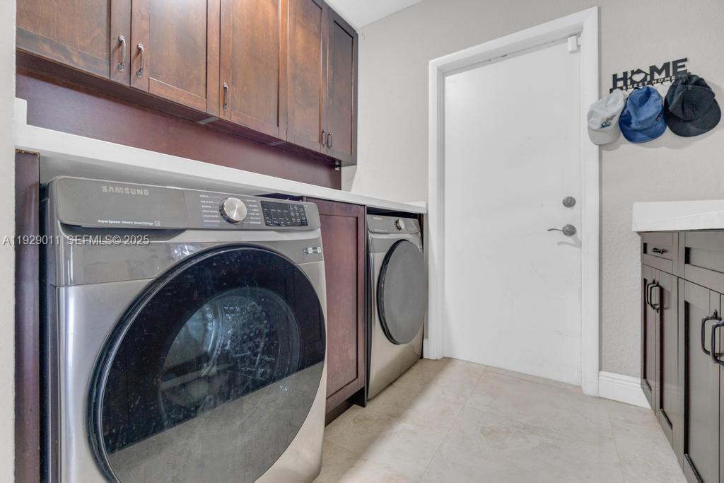 16900 Southwest 276th Street Homestead, FL 33031 - Photo 17 of 22 a utility room with dryer and washer