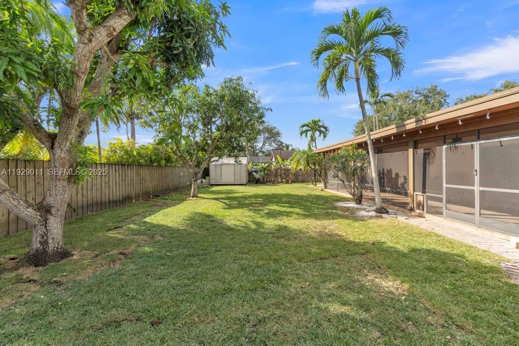 16900 Southwest 276th Street Homestead, FL 33031 - Photo 19 of 22 a view of a house with backyard and sitting area