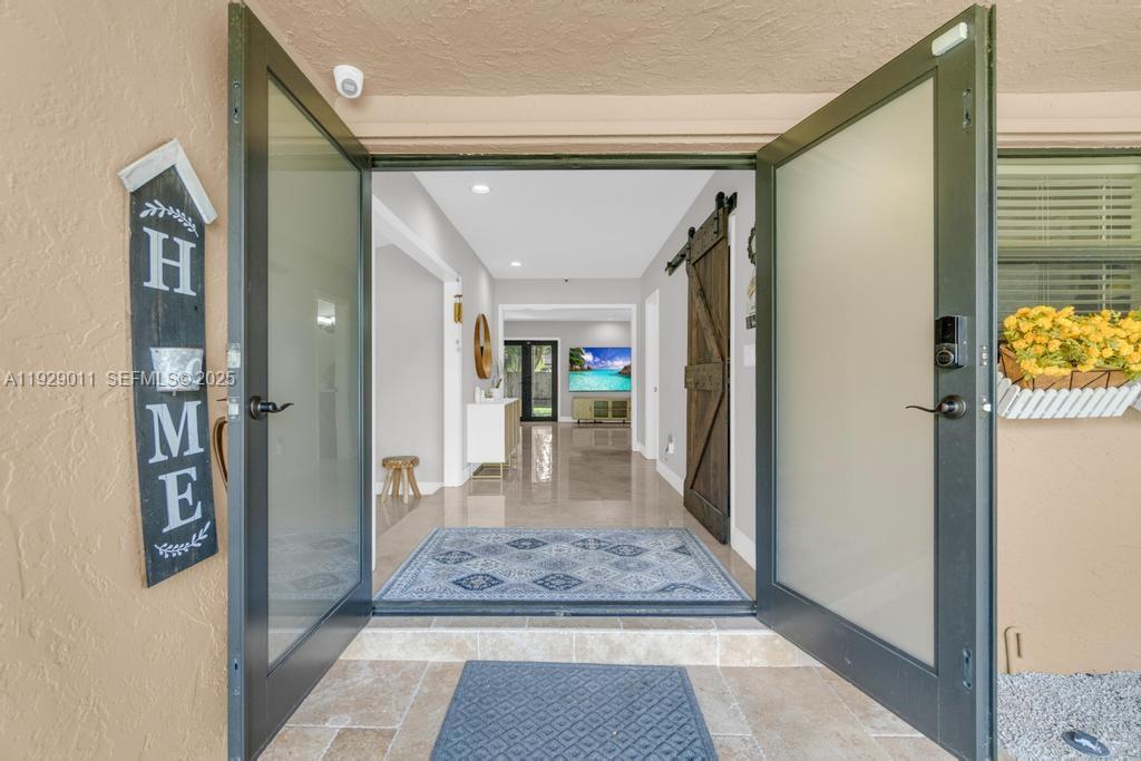 16900 Southwest 276th Street Homestead, FL 33031 - Photo 21 of 22 a view of a hallway with a dining area