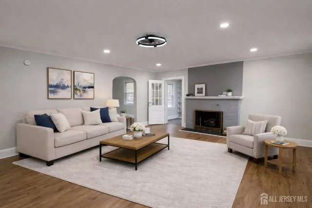 a living room with furniture and a fireplace