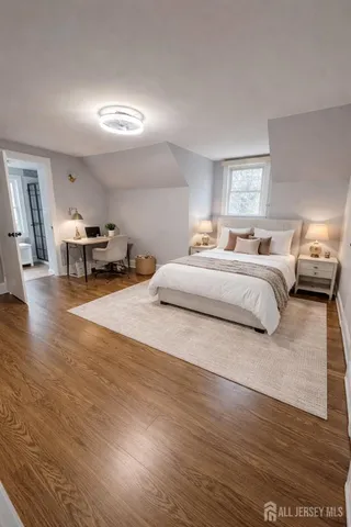 a spacious bedroom with a bed and a couch