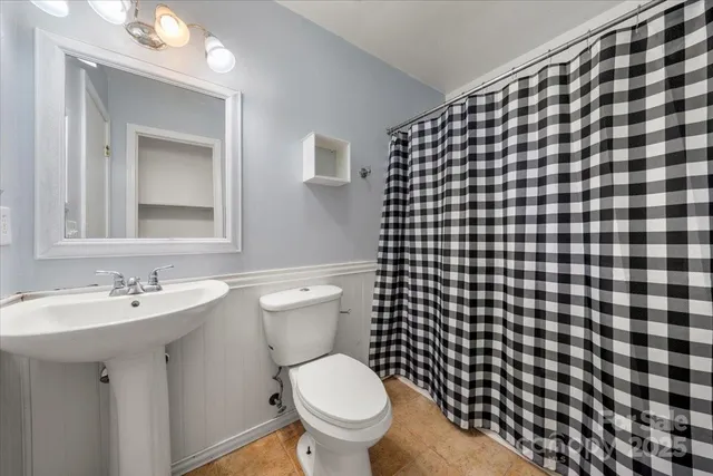 a bathroom with a toilet and a sink