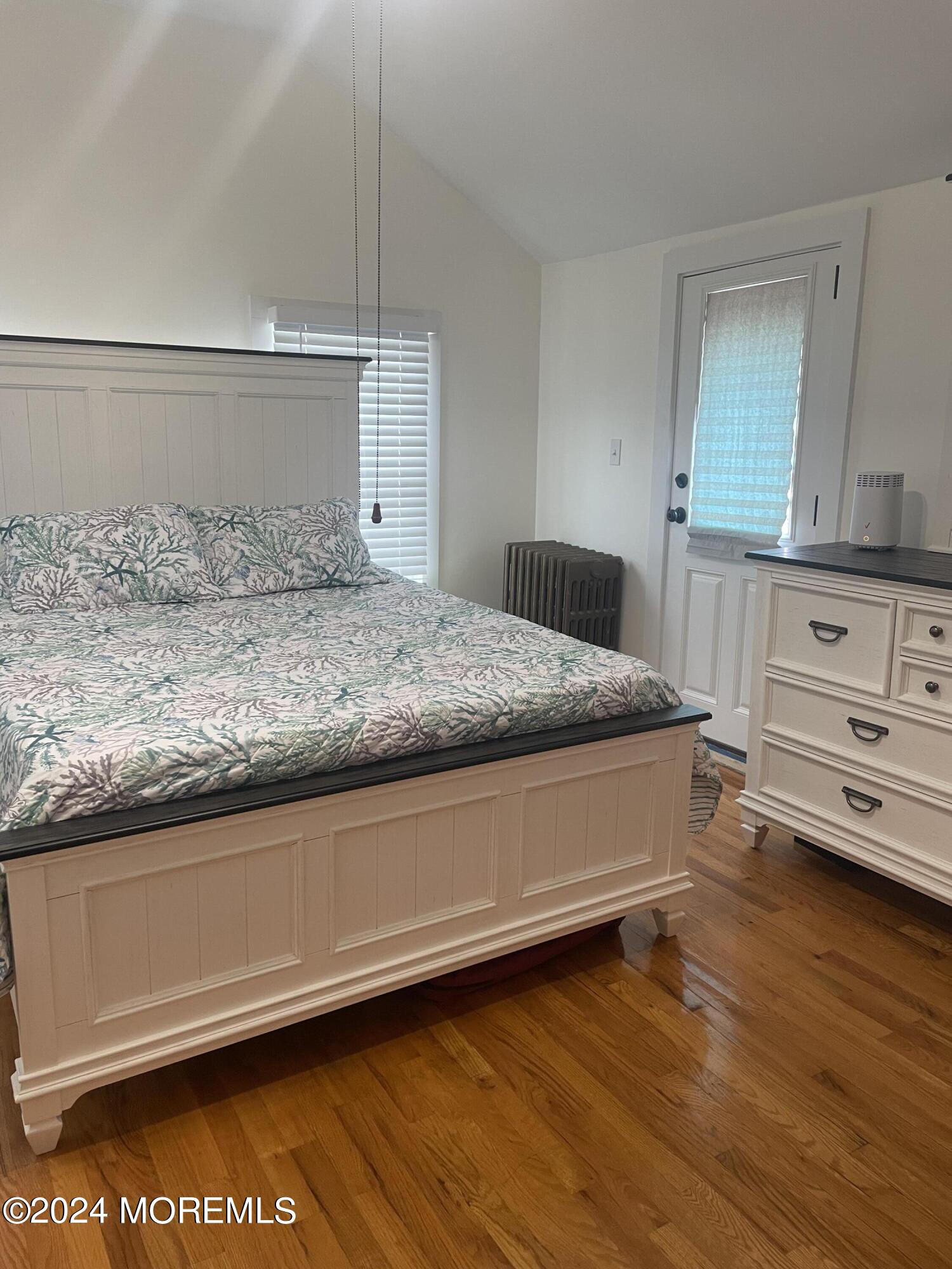 64 Abbott Avenue Ocean Grove, NJ 07756 - Photo 14 of 19 a spacious bedroom with a bed and a dresser