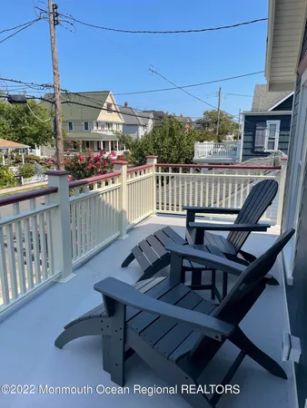 a view of a balcony with chairs