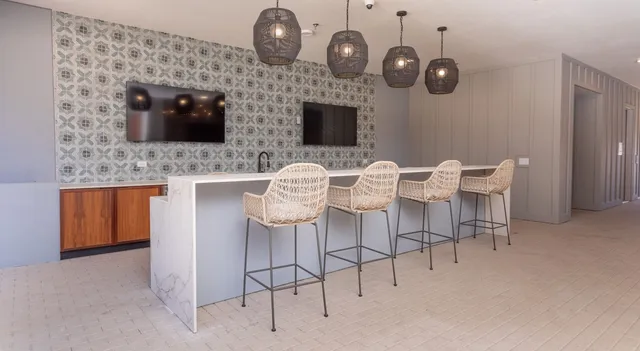 a dining room with furniture and chandelier
