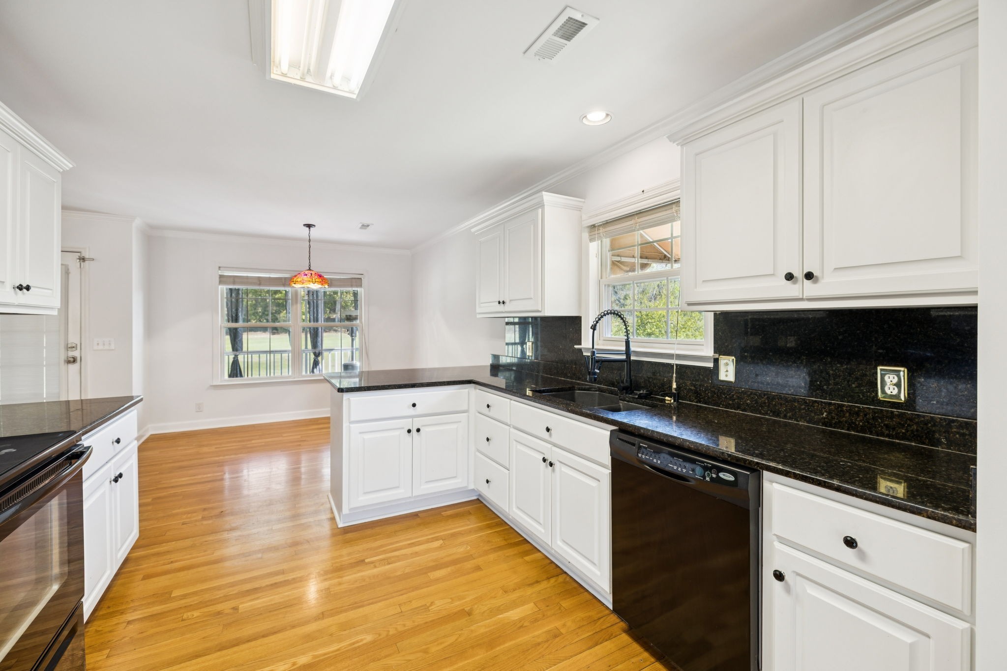 3679 Old State Highway 11 Springfield, TN 37172 - Photo 11 of 50 a kitchen with granite countertop a stove sink and cabinets