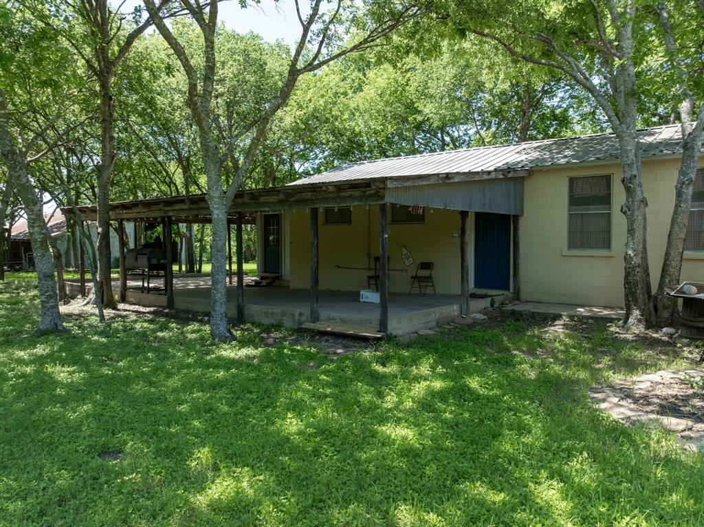 1355 North Houston Street Lorena, TX 76655 - Photo 10 of 40 a view of a house with backyard and porch