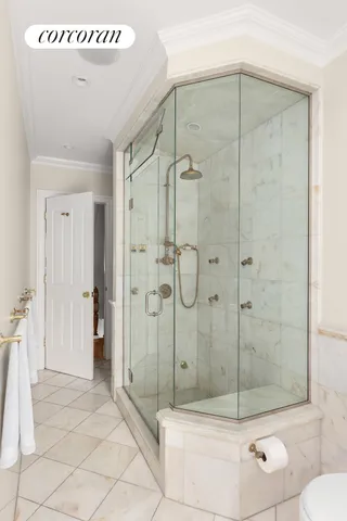 a living room with furniture a window and a flat screen tv