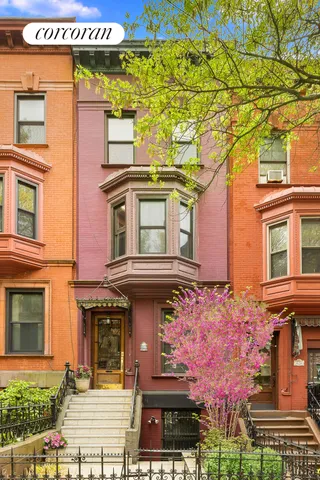 a living room with wooden floor and furniture