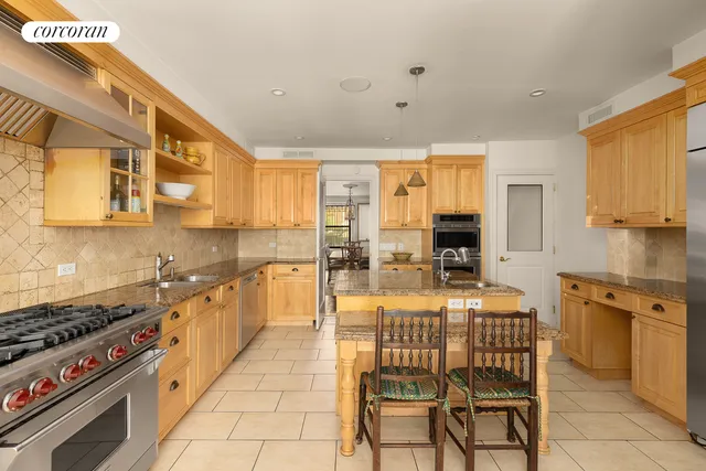 a bedroom with a bed and a couch next to a window