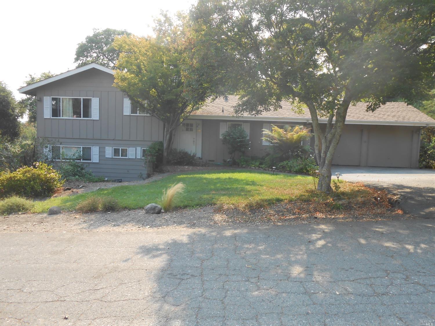 4775 Holly Street Santa Rosa, CA 95404 - Photo 1 of 1 a view of a house with backyard and a tree