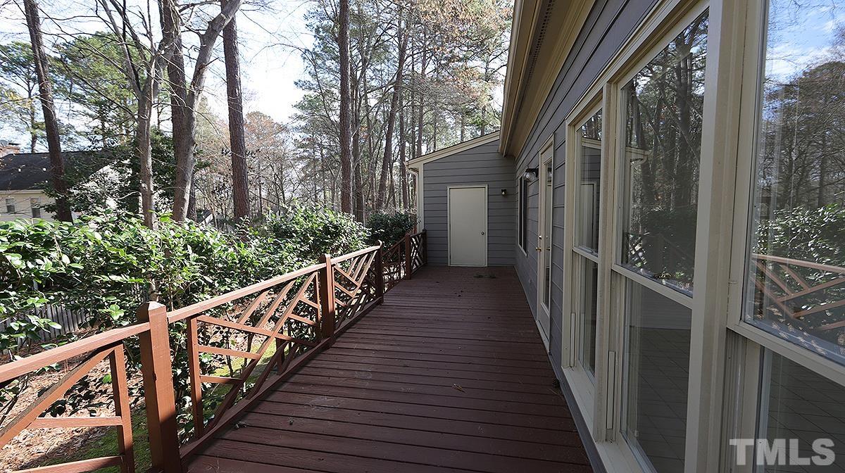 7949 Footman Way Raleigh, NC 27615 - Photo 26 of 28 a view of a house with wooden staircase