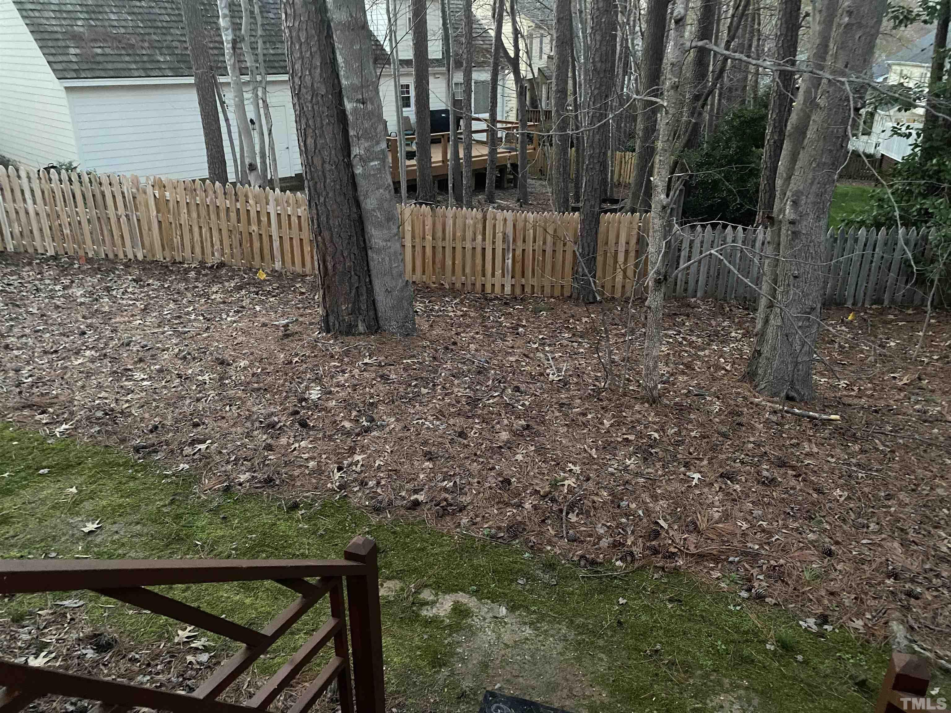 7949 Footman Way Raleigh, NC 27615 - Photo 5 of 28 a view of a wooden fence yard