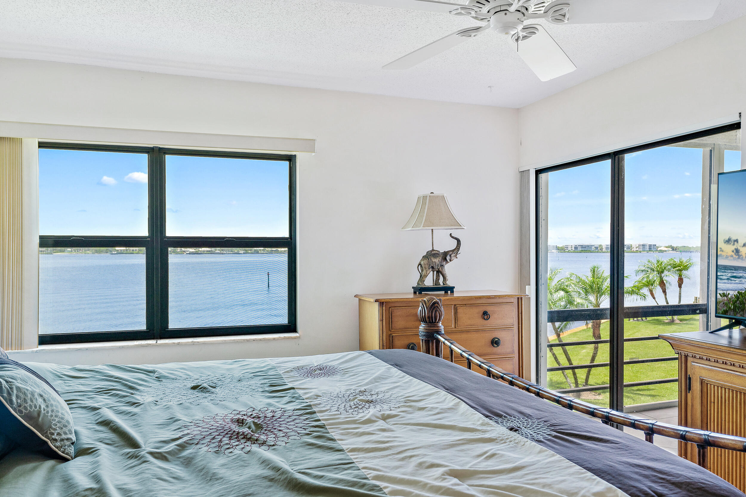 1950 Southwest Palm City Road, Unit 1202 Stuart, FL 34994 - Photo 11 of 21 a bedroom with a bed and large window