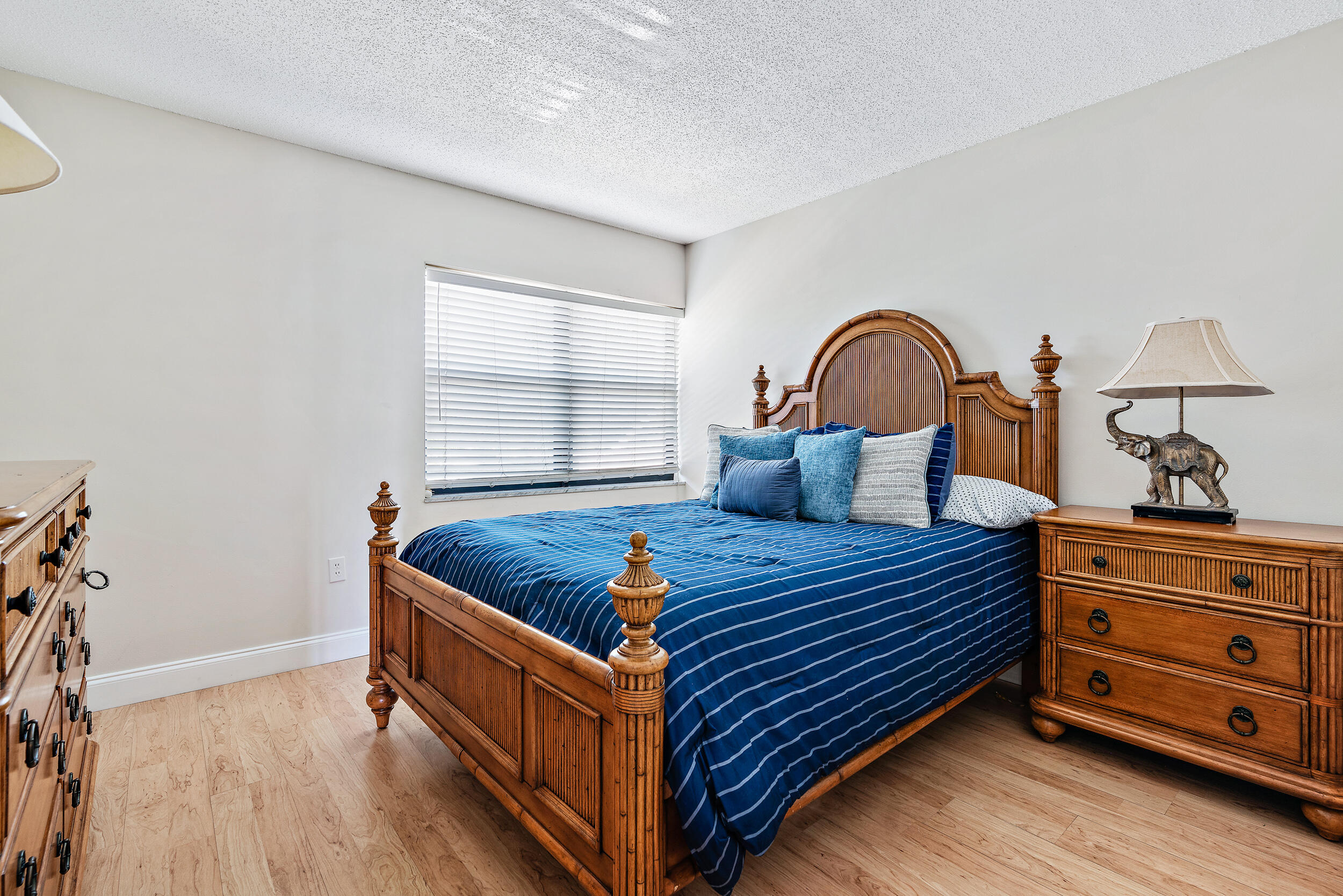 1950 Southwest Palm City Road, Unit 1202 Stuart, FL 34994 - Photo 14 of 21 a bed room with a bed and a window