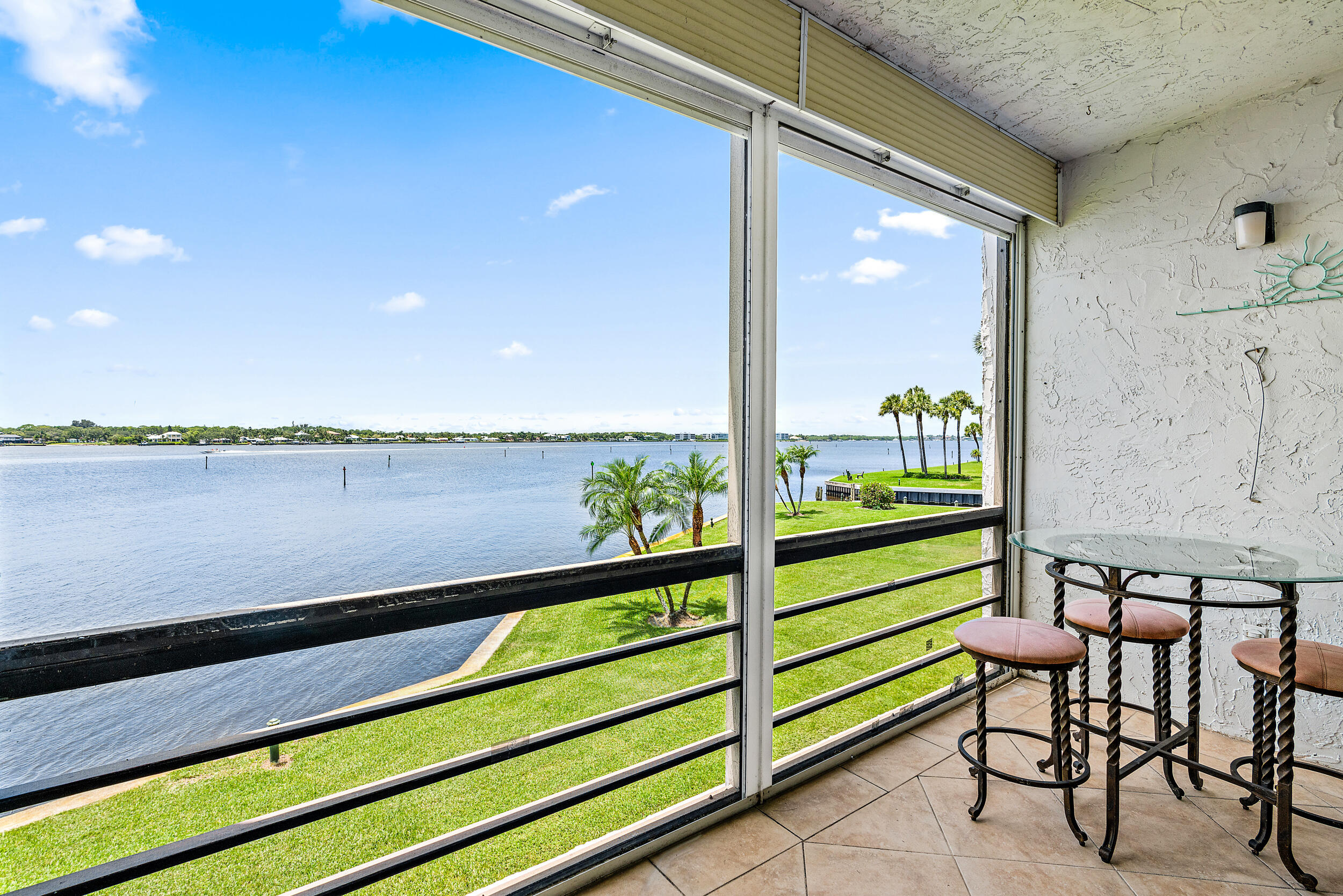 1950 Southwest Palm City Road, Unit 1202 Stuart, FL 34994 - Photo 2 of 21 a view of a chairs and table on the balcony