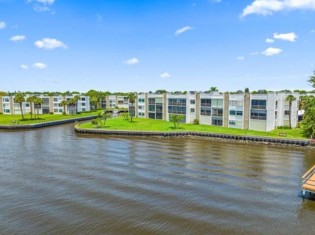 1950 Southwest Palm City Road, Unit 1202 Stuart, FL 34994 - Photo 21 of 21 a view of a lake with a city