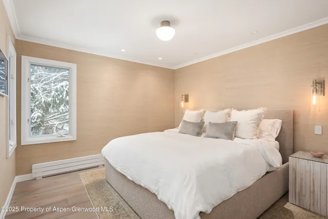 a bedroom with bed and a night stand