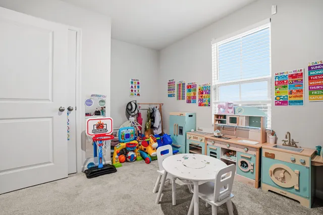 a room with furniture a washer and dryer