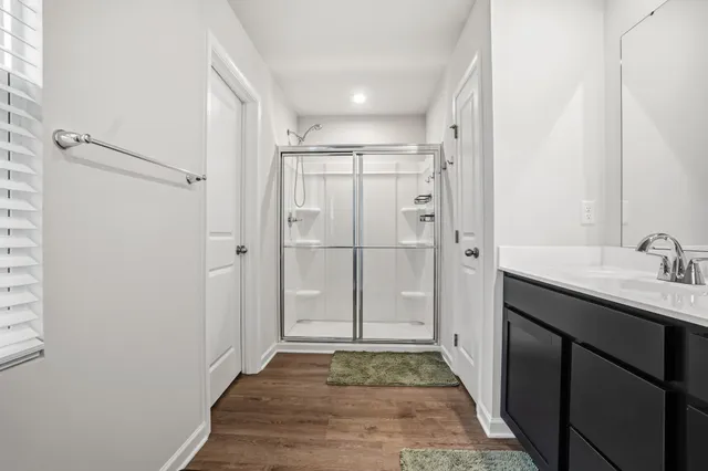 a bedroom with furniture and a window