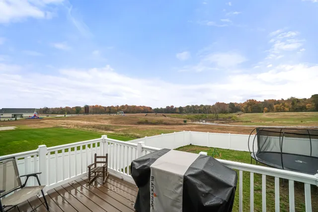 a view of a lake with a garden and houses